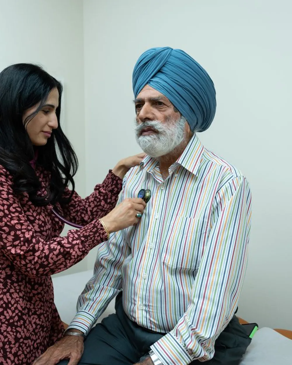 A doctor caring for a patient during a checkup