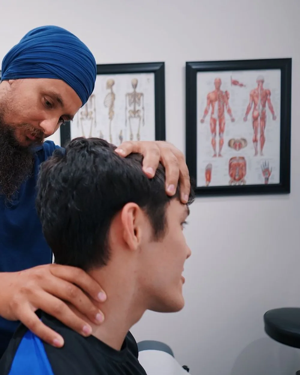 A clinician examining a patient’s neck after an accident